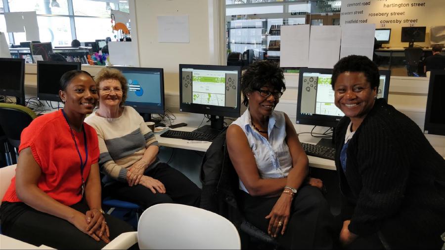 A community group in Moss Side library using PlaceCal to find out what’s on